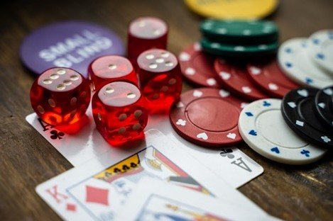 Poker Chips, dice, cards on a table
